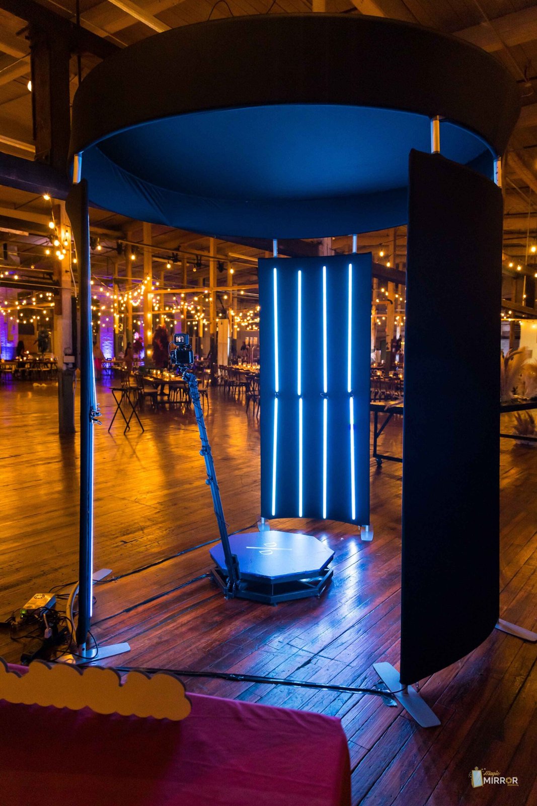 360 photo booth platform with LED tower in a loft venue