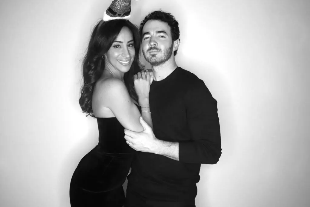 Couple posing for a black-and-white glam booth portrait at a New York event