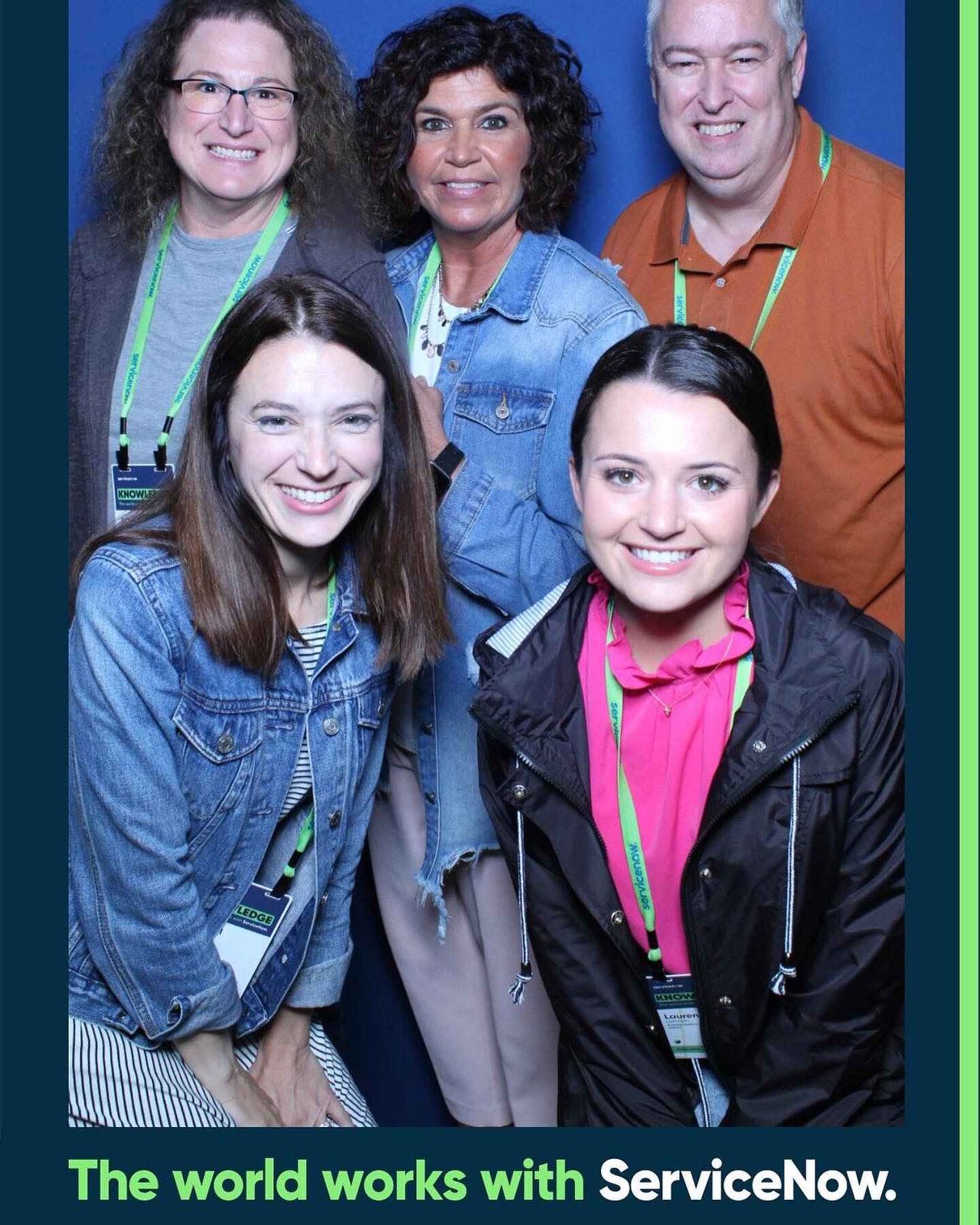 Friends posing at a conference photo booth activation