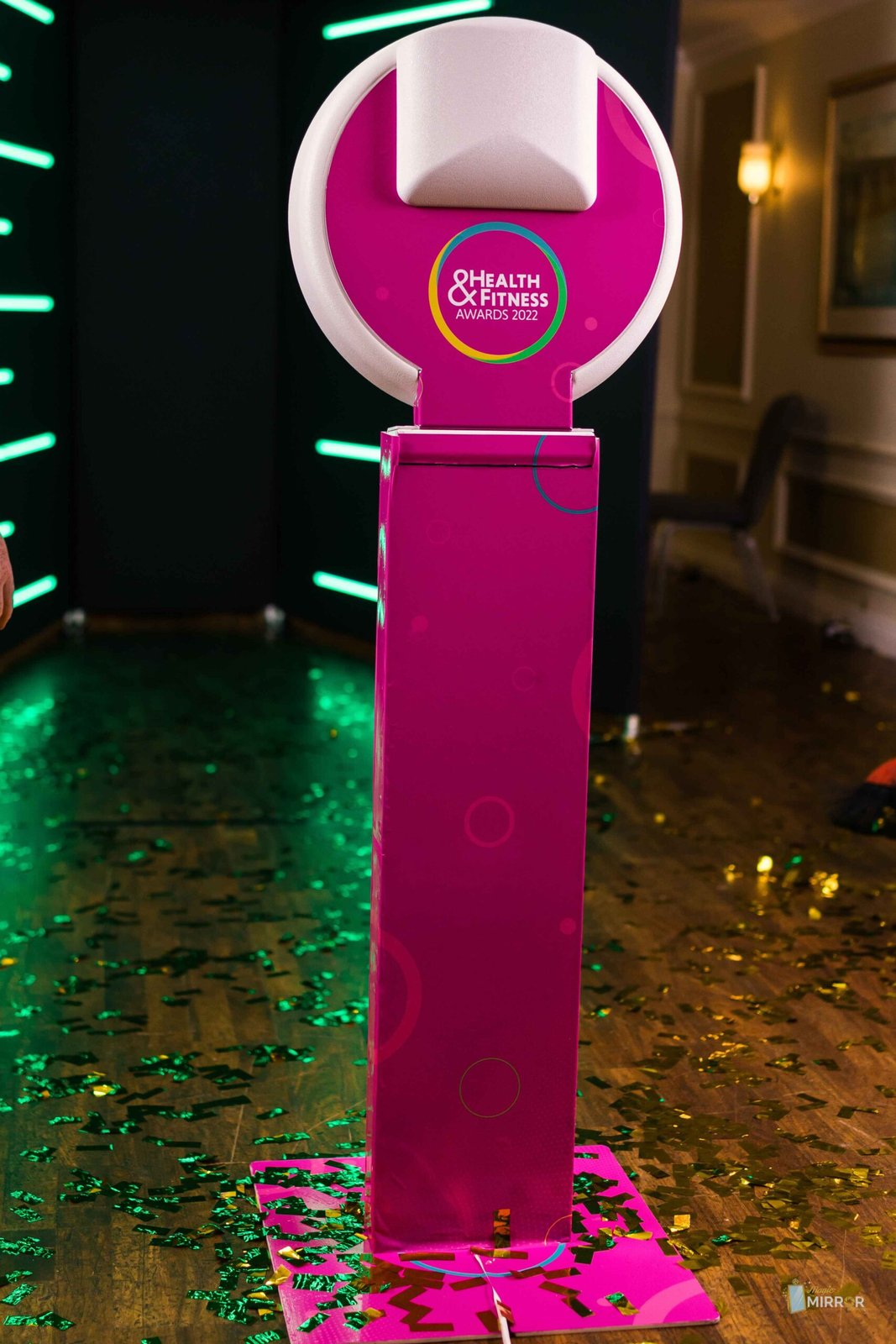 Custom pink-wrapped booth kiosk at a brand event