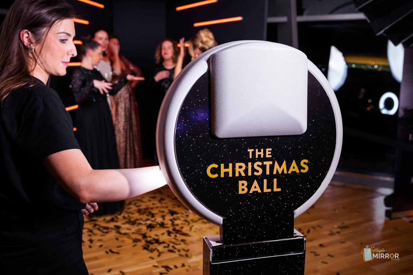 The Christmas Ball branded ring light booth at a corporate party