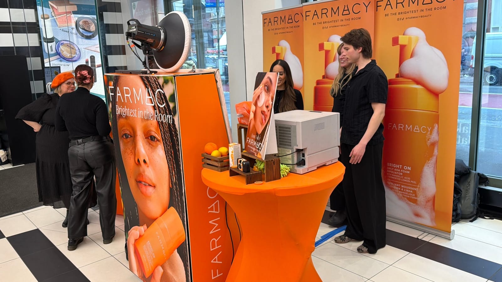 Fully branded photo booth kiosk and print station at the Farmacy Beauty pop-up