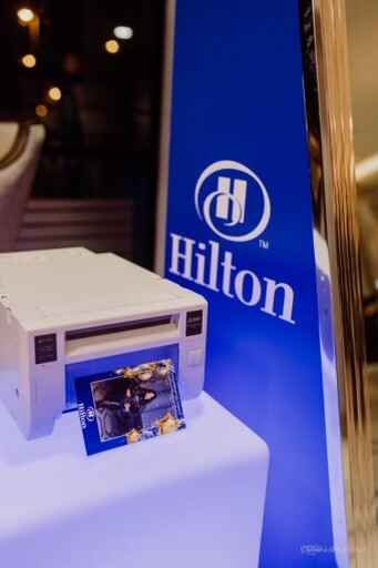 Print station at a Hilton-branded photo booth activation