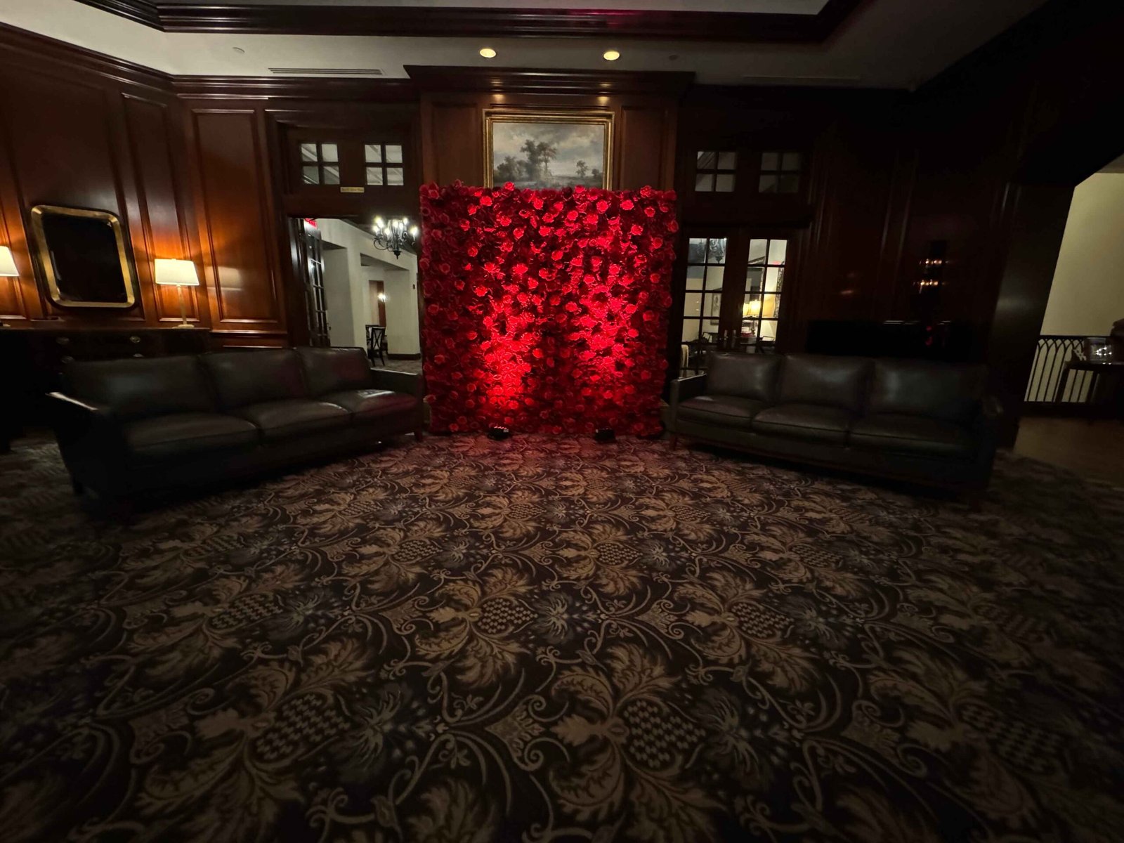 Red flower wall glowing in an event space