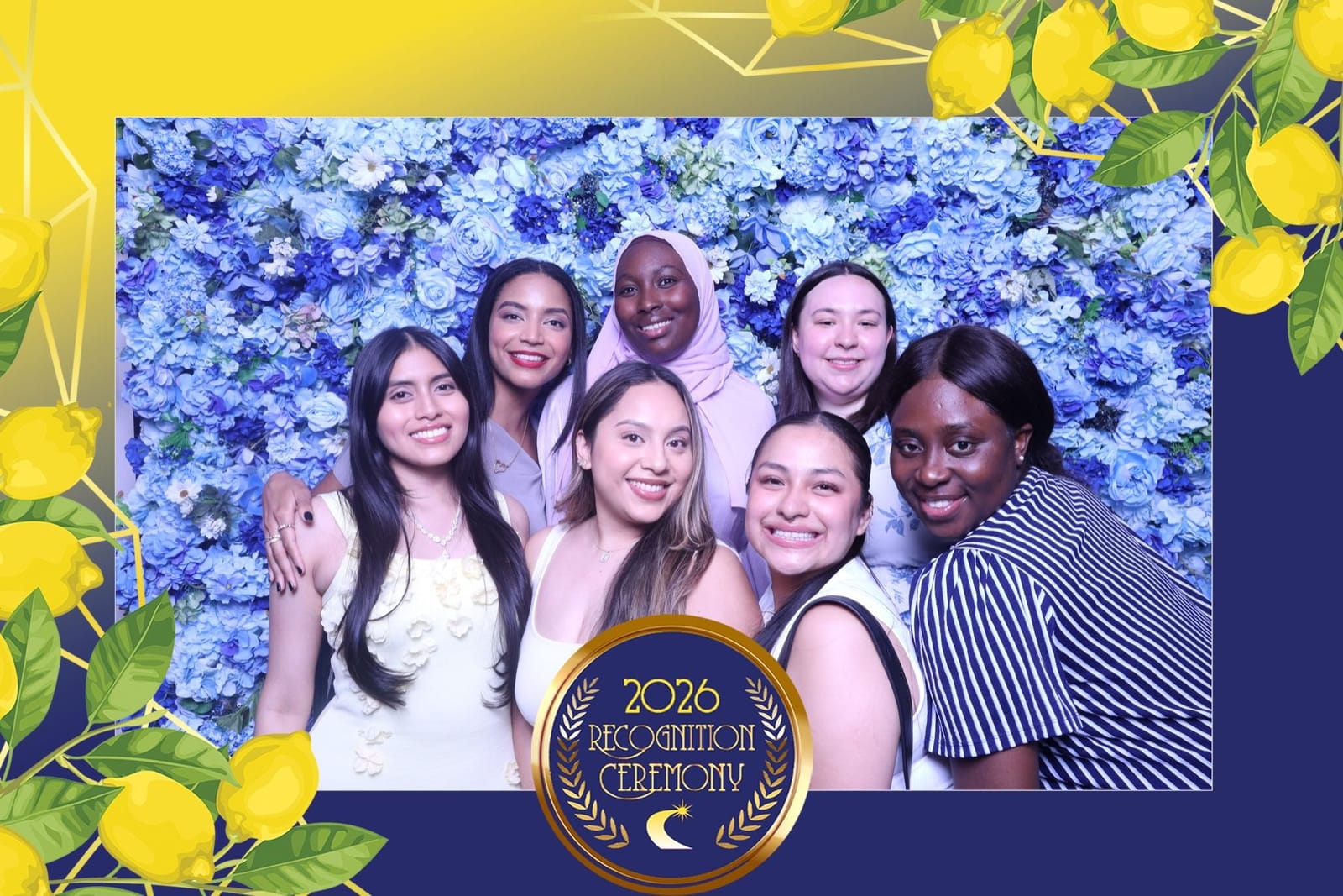 Group of guests smiling at the blue flower wall — custom event print