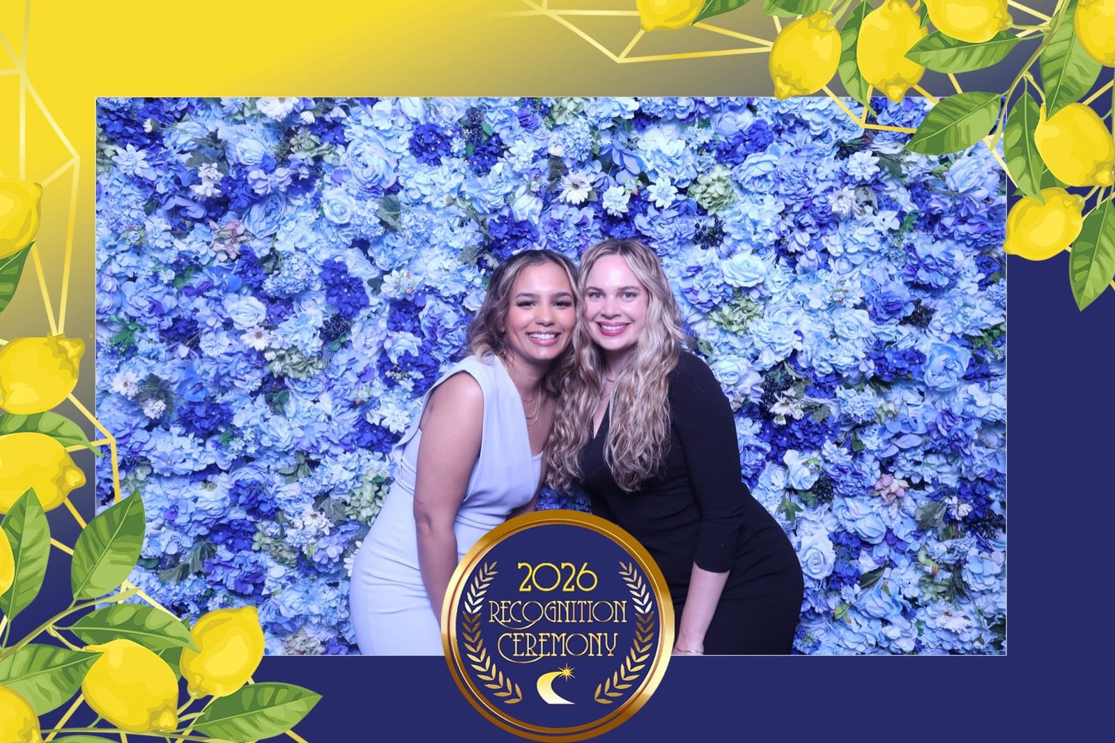 Two friends posing at the blue flower wall with a custom print template