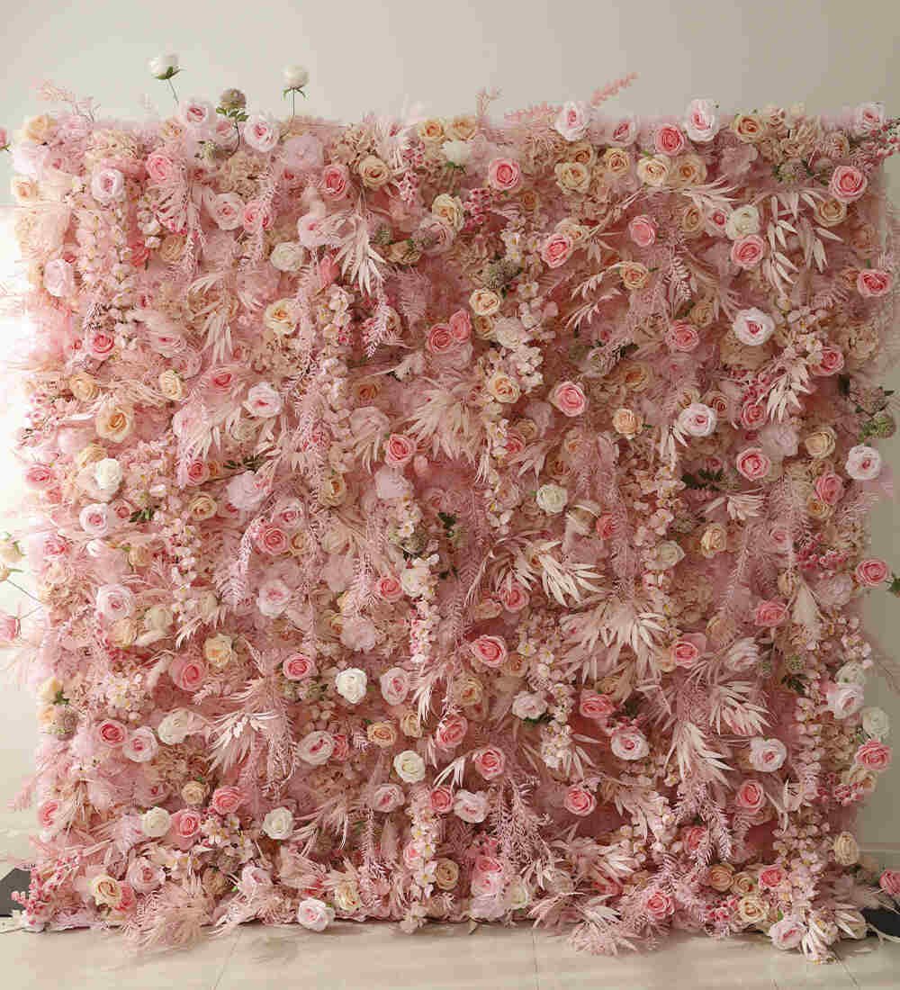Pink flower wall with feather accents