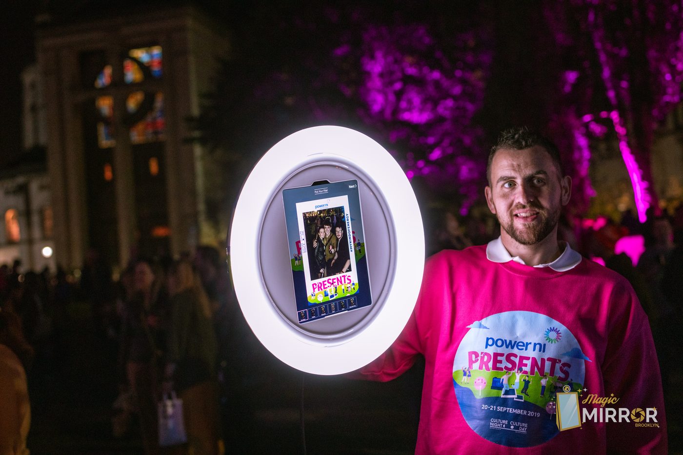Guests collecting instant prints from the photo booth at an NYC celebration