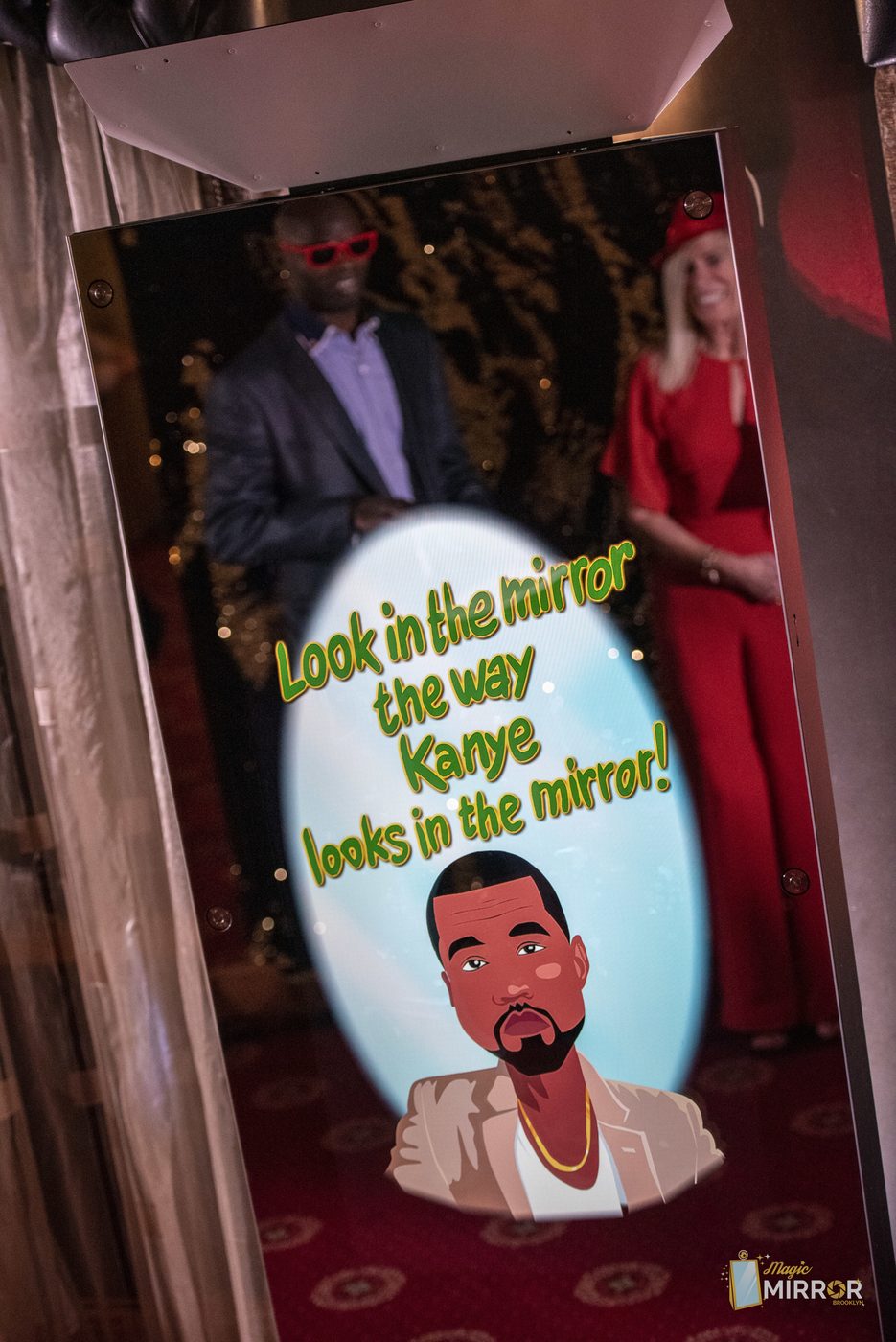 Couple taking a photo at the mirror booth during a tri-state area wedding
