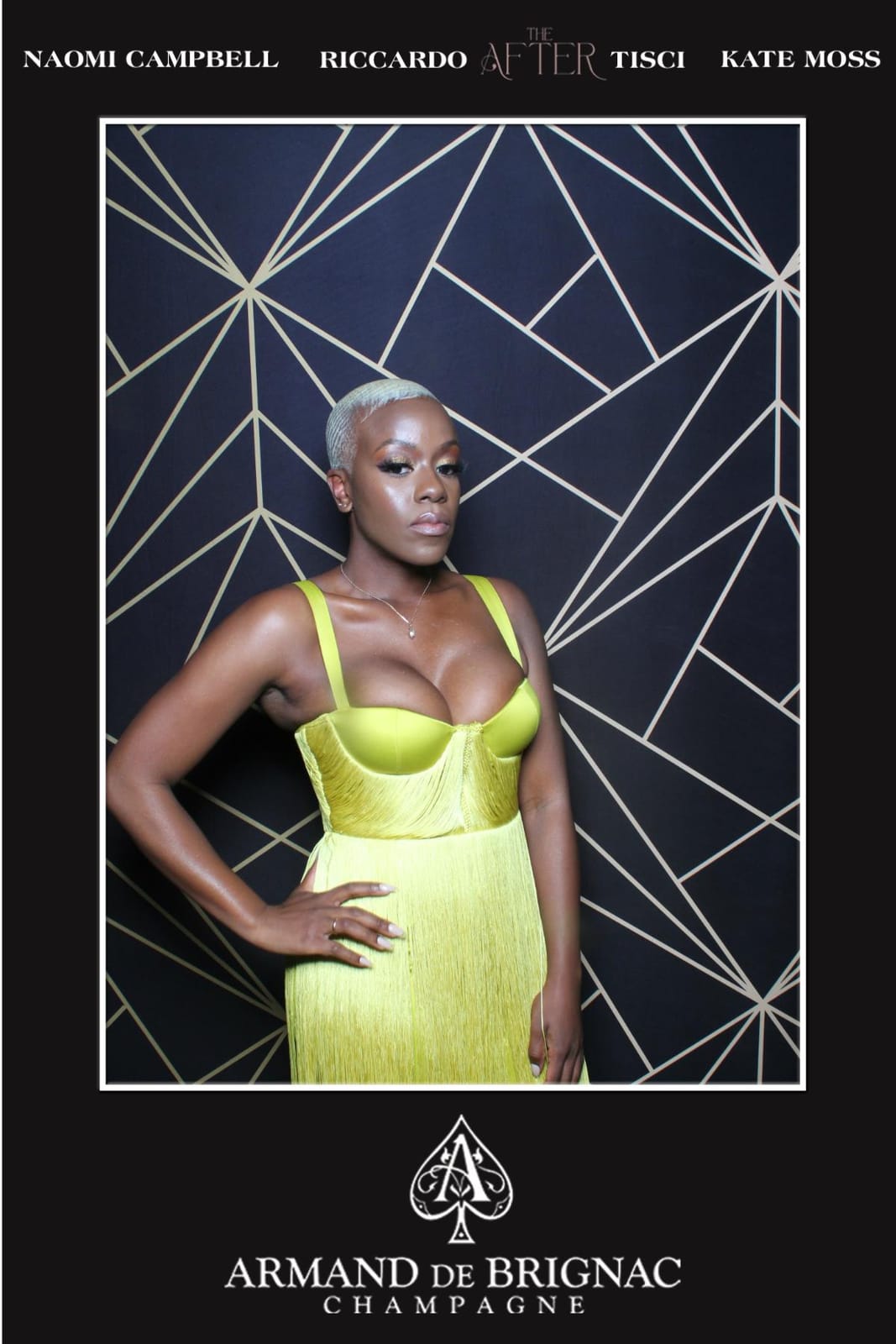 Guest in a chartreuse gown at the Armand de Brignac THE AFTER party — black and gold geometric backdrop