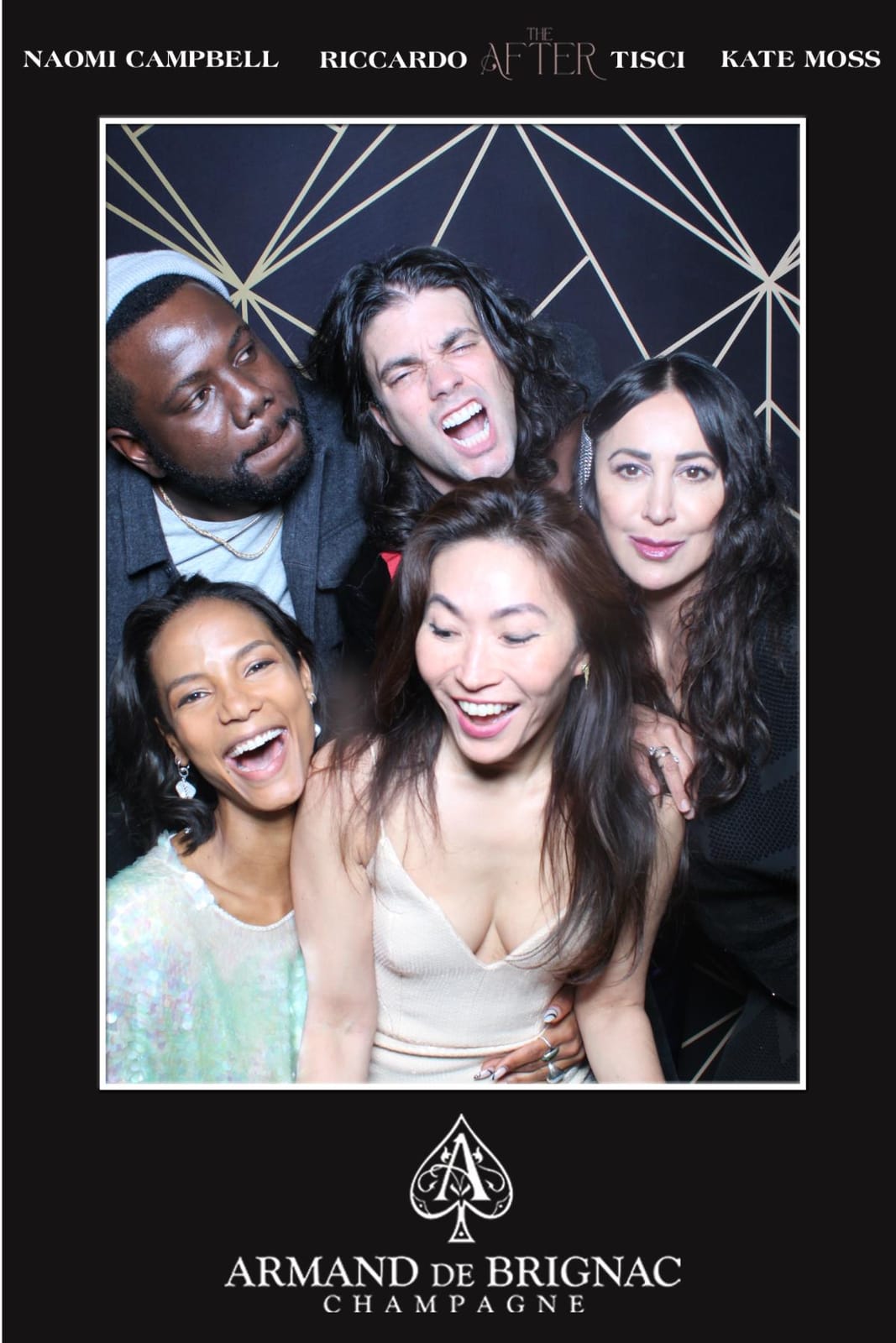 Group of friends crowding the frame at the Armand de Brignac after-party