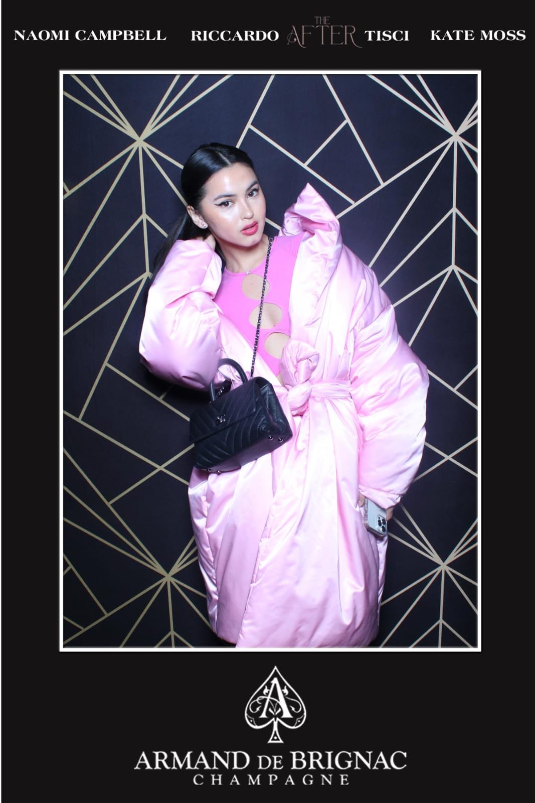 Guest in a pink faux-fur coat at the Armand de Brignac after-party