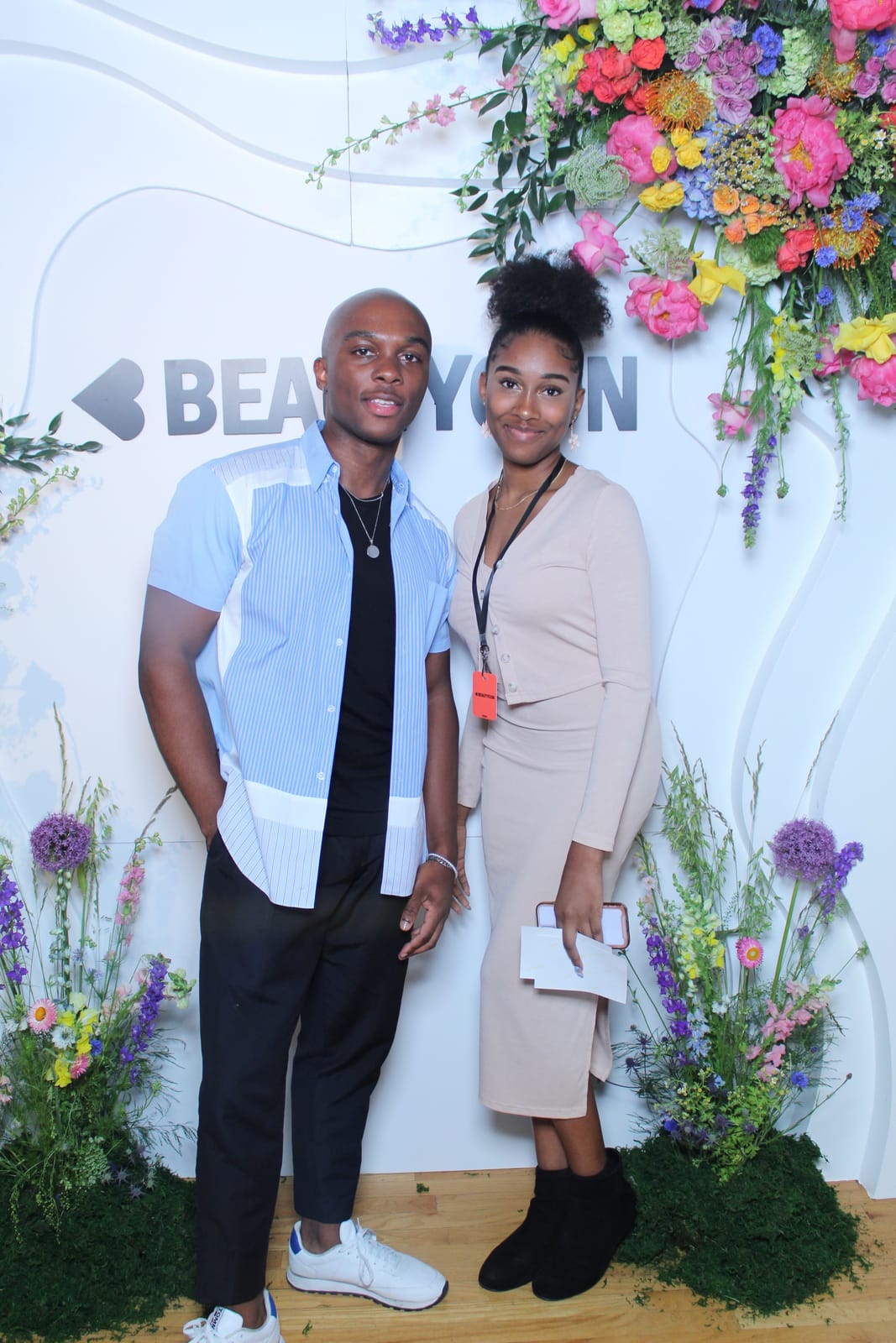 Couple posing together at the Beautycon photo booth