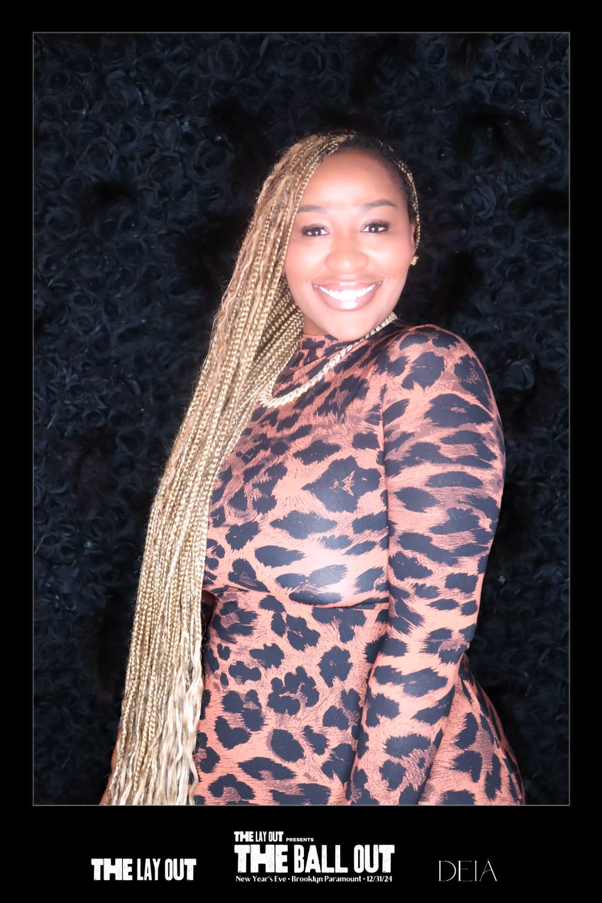 Guest in leopard print at The Ball Out — black rose wall backdrop