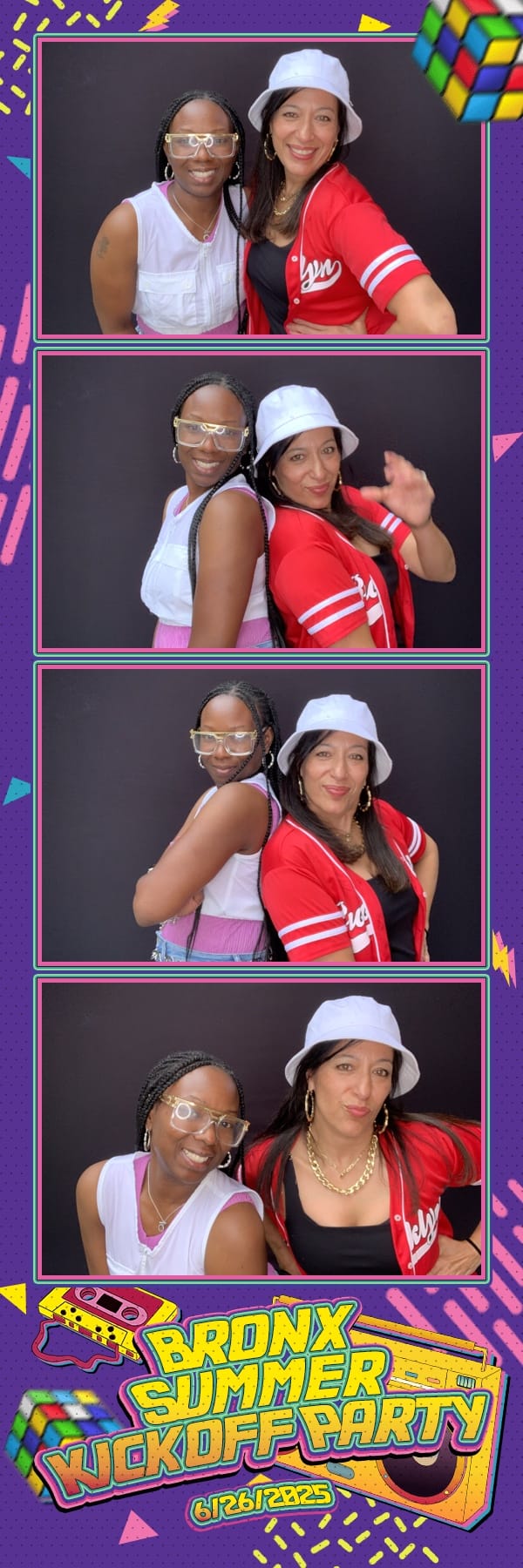 Two friends posing back to back at the Bronx Summer Kickoff Party photo booth