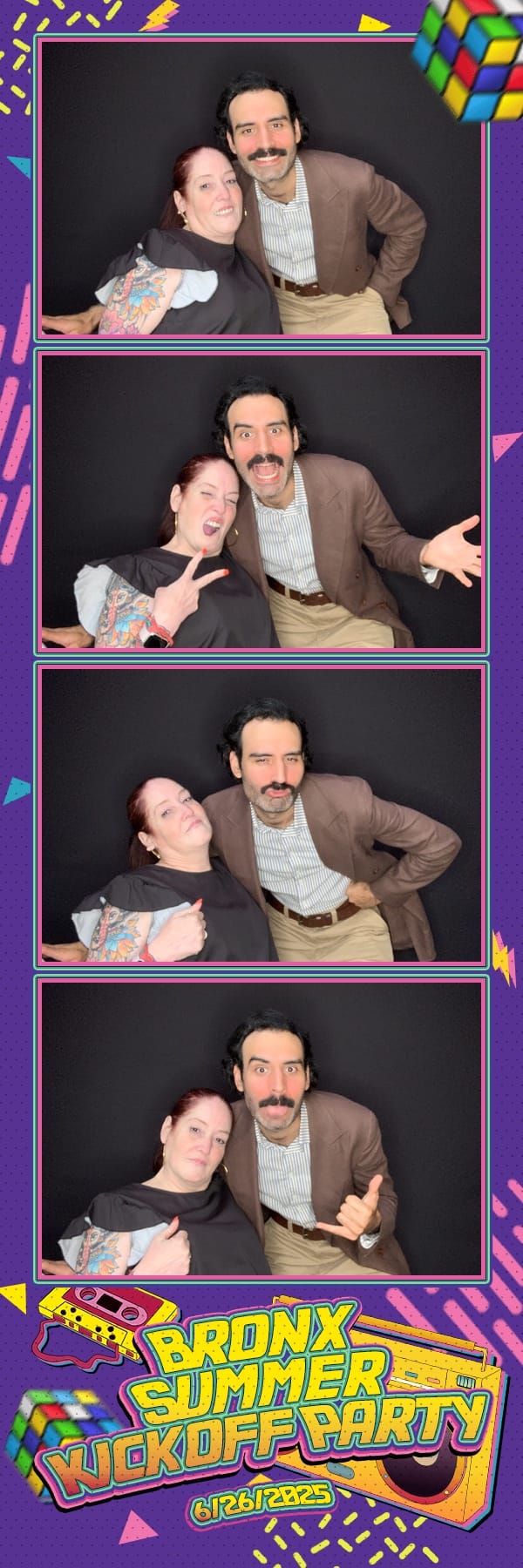 Two guests hamming it up at the Bronx Summer Kickoff Party booth
