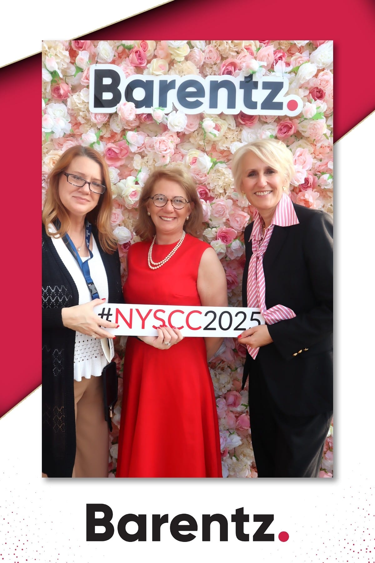 Three guests with the NYSCC 2025 sign at the Barentz flower wall