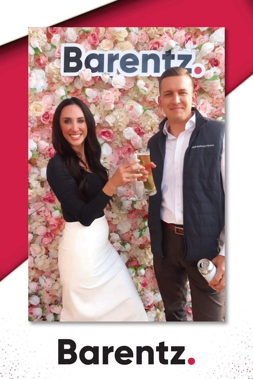 Two guests toasting at the Barentz NYSCC 2025 booth