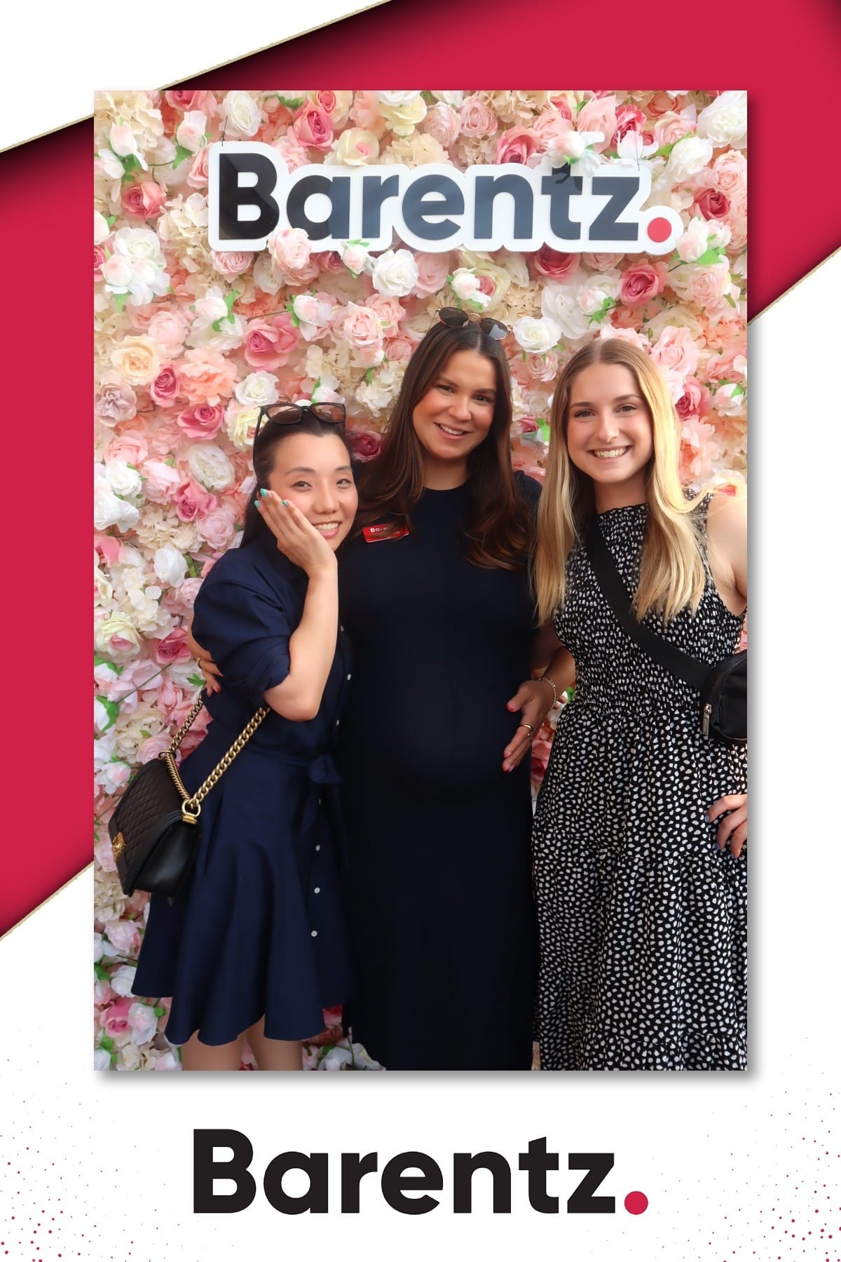 Three colleagues posing at the Barentz flower wall at NYSCC 2025