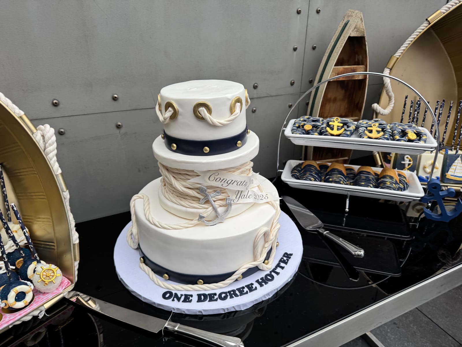 Guests posing on the rooftop with a champagne tower at the Captain's Ball