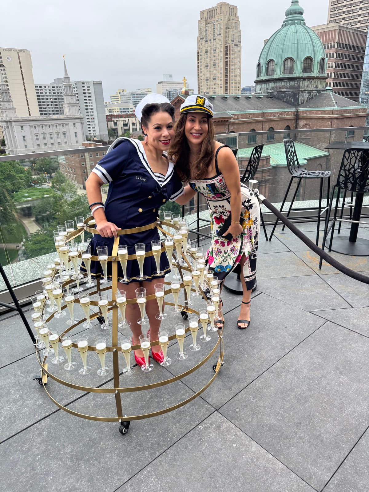 Guests in nautical-themed outfits posing at the Captain's Ball