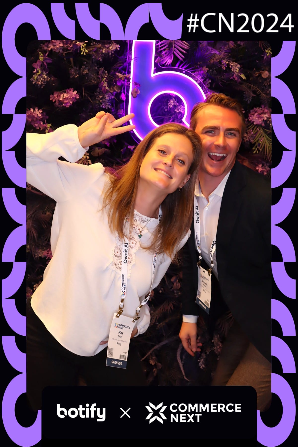Two Botify sponsors laughing together at the CommerceNext 2024 photo booth