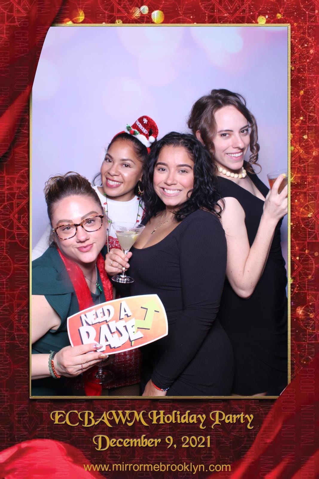 Colleagues at the ECBAWM Holiday Party 2021 booth