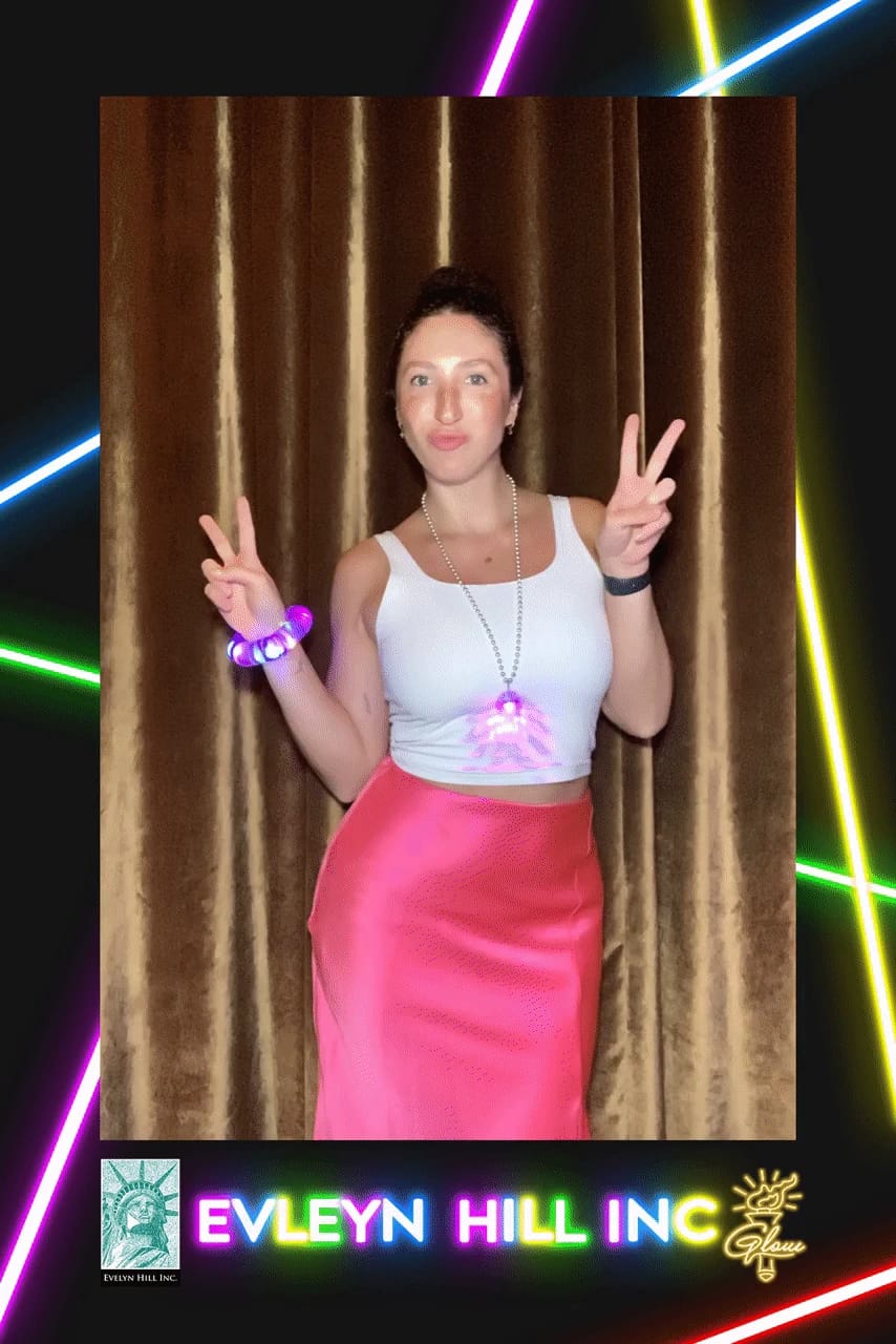 Guest flashing peace signs with LED glow accessories at the Evelyn Hill Inc party