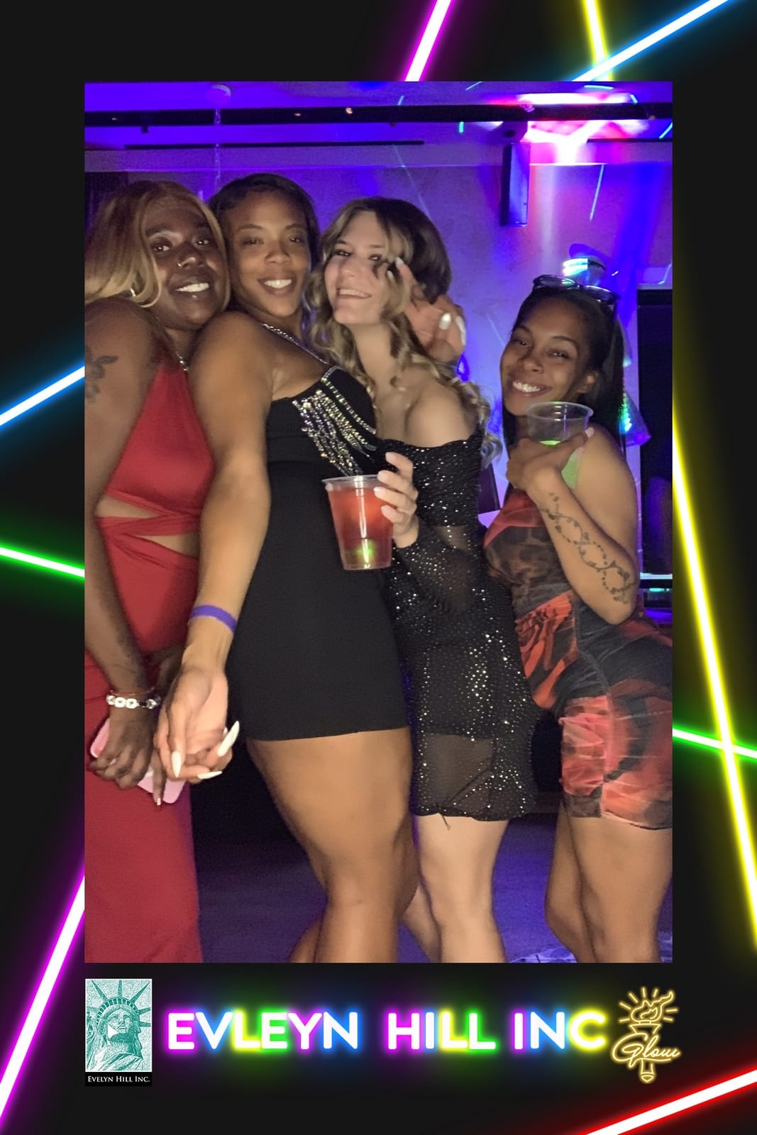 Four friends together at the Evelyn Hill Inc company dinner — neon print frame