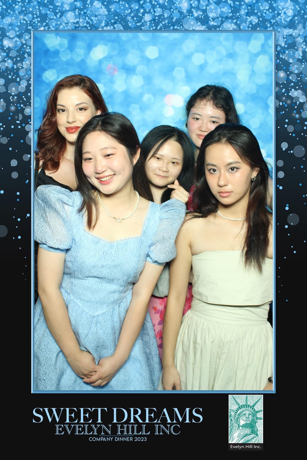 Guests at the Evelyn Hill Inc 2023 company dinner photo booth