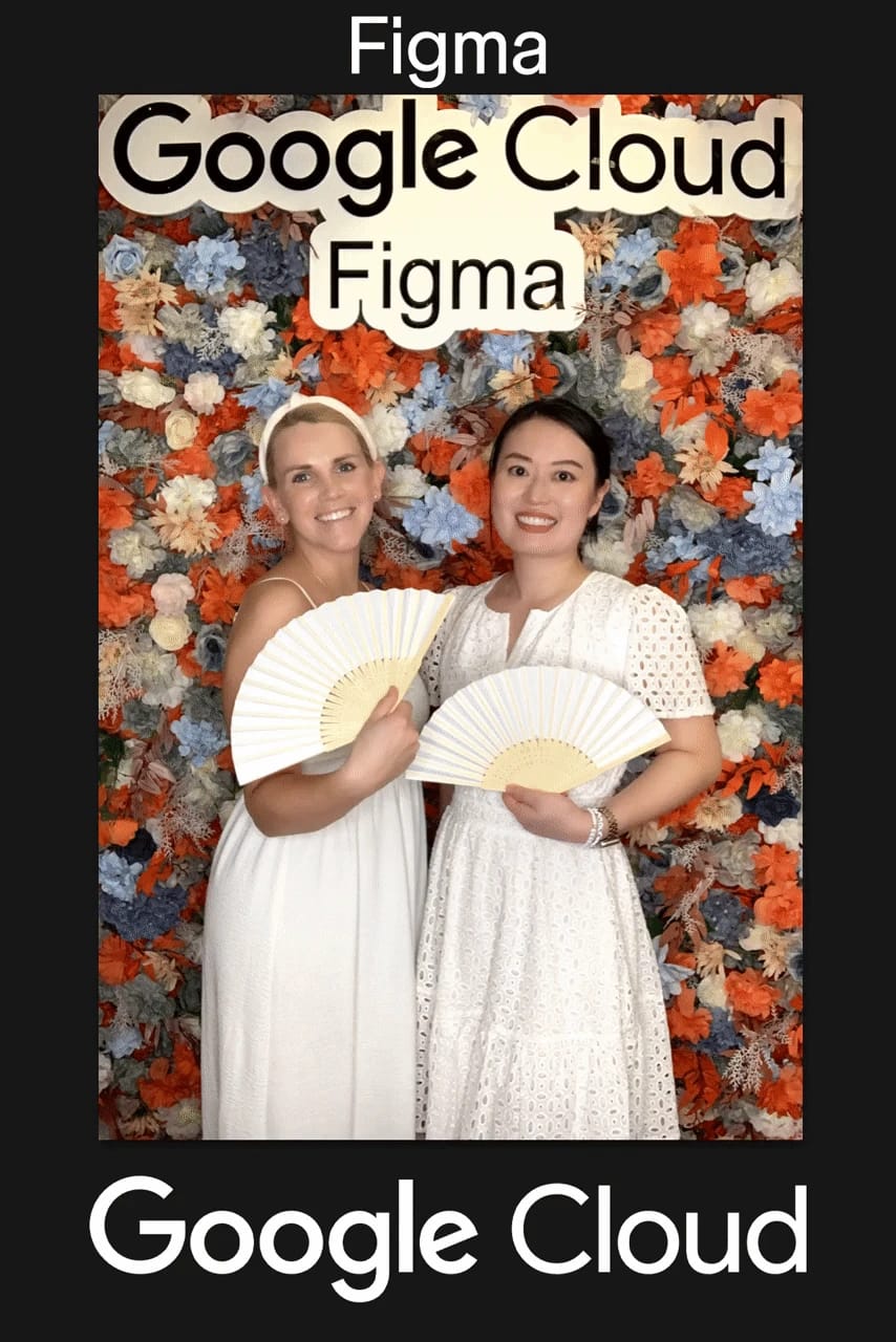 Four colleagues smiling at the Google Cloud × Figma event flower wall