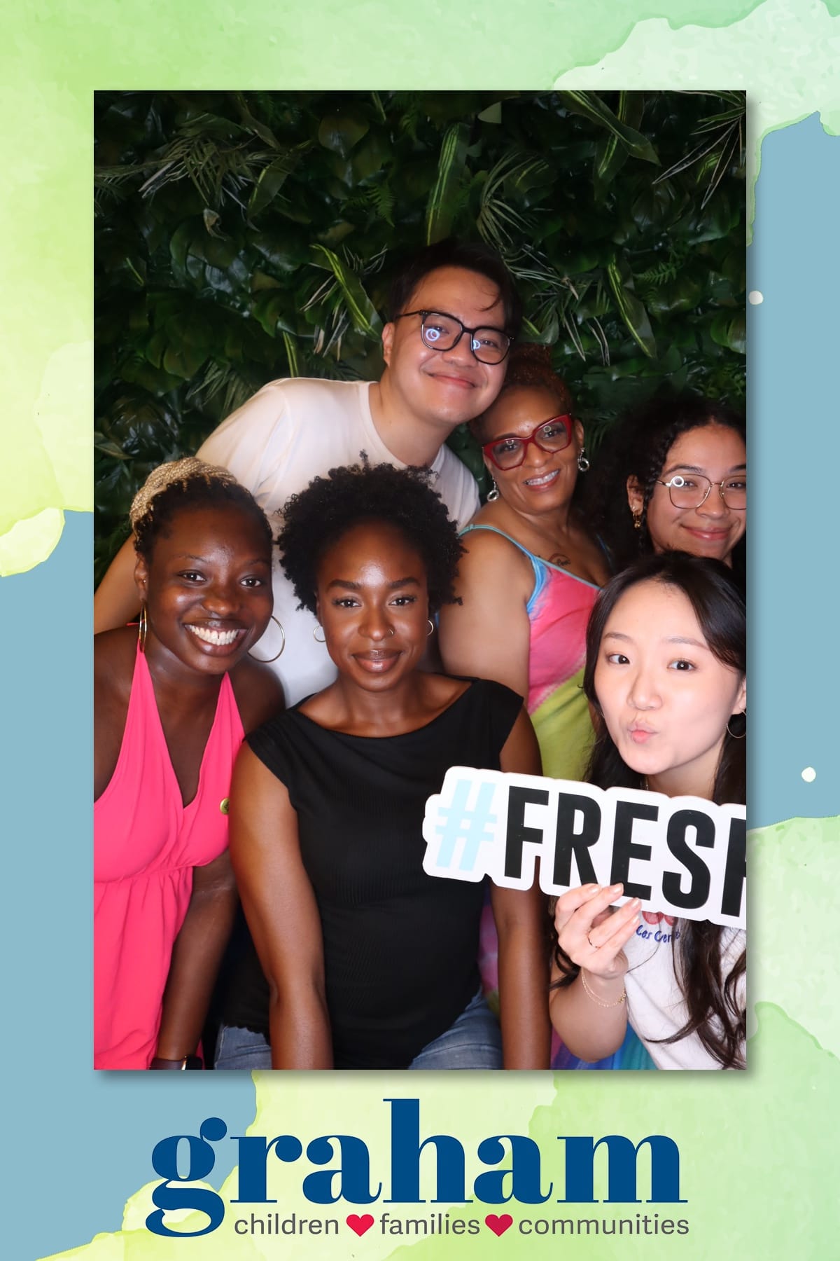 Guests with a Fresh sign at the Graham event photo booth