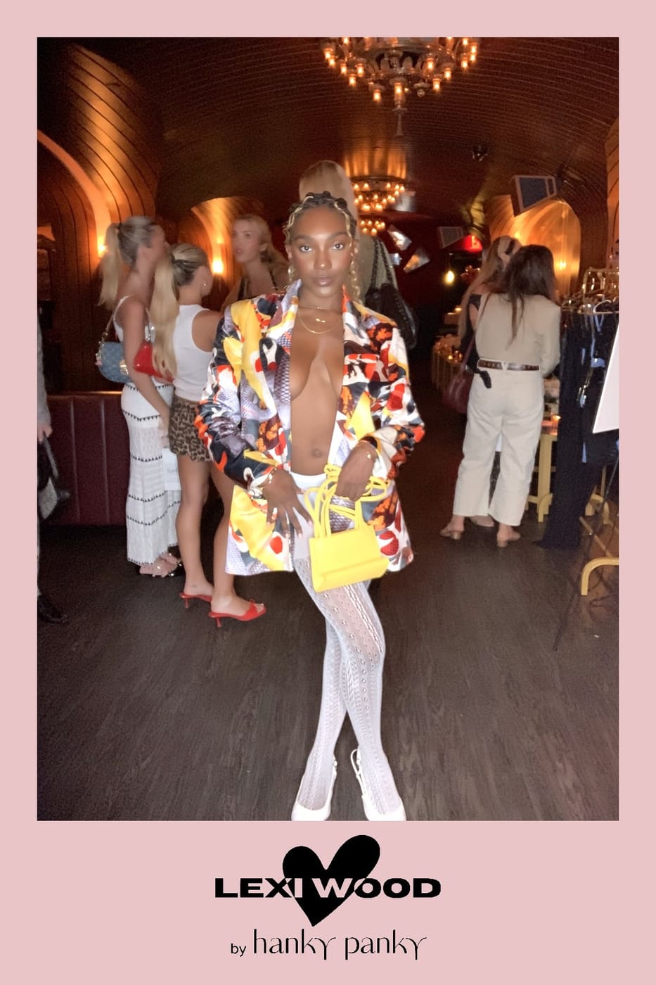 Bold print blazer and white lace tights at the Lexi Wood launch