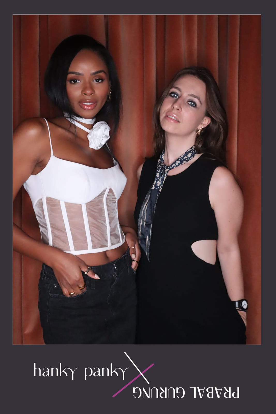 Two guests posing at the Hanky Panky x Prabal Gurung photo booth