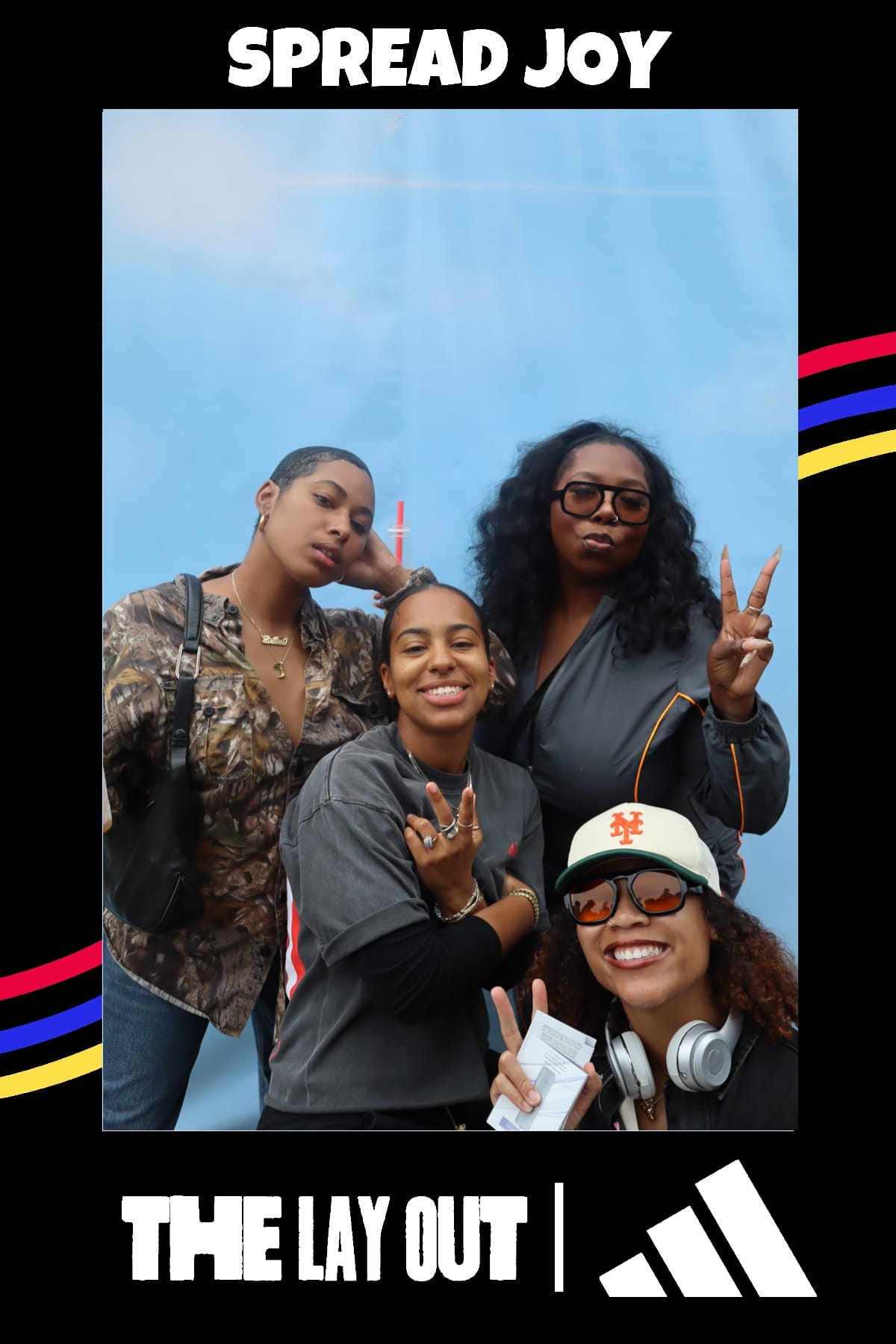 Four friends posing at The Lay Out x adidas Juneteenth event — Spread Joy print frame