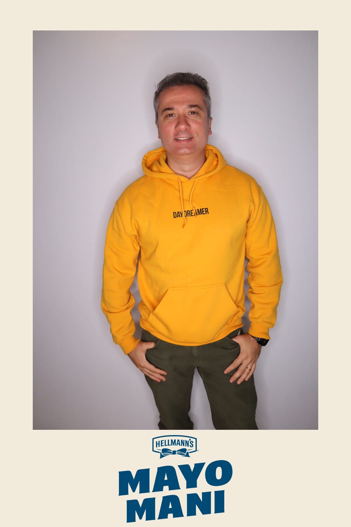 Guest in a yellow Daydreamer hoodie at the Hellmann's Mayo Mani booth
