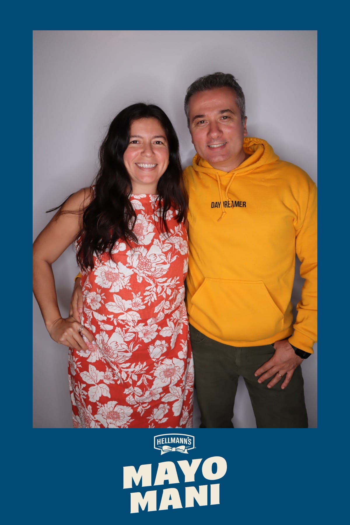 Guest in a tie-dye tank with a cocktail at the Hellmann's Mayo Mani booth