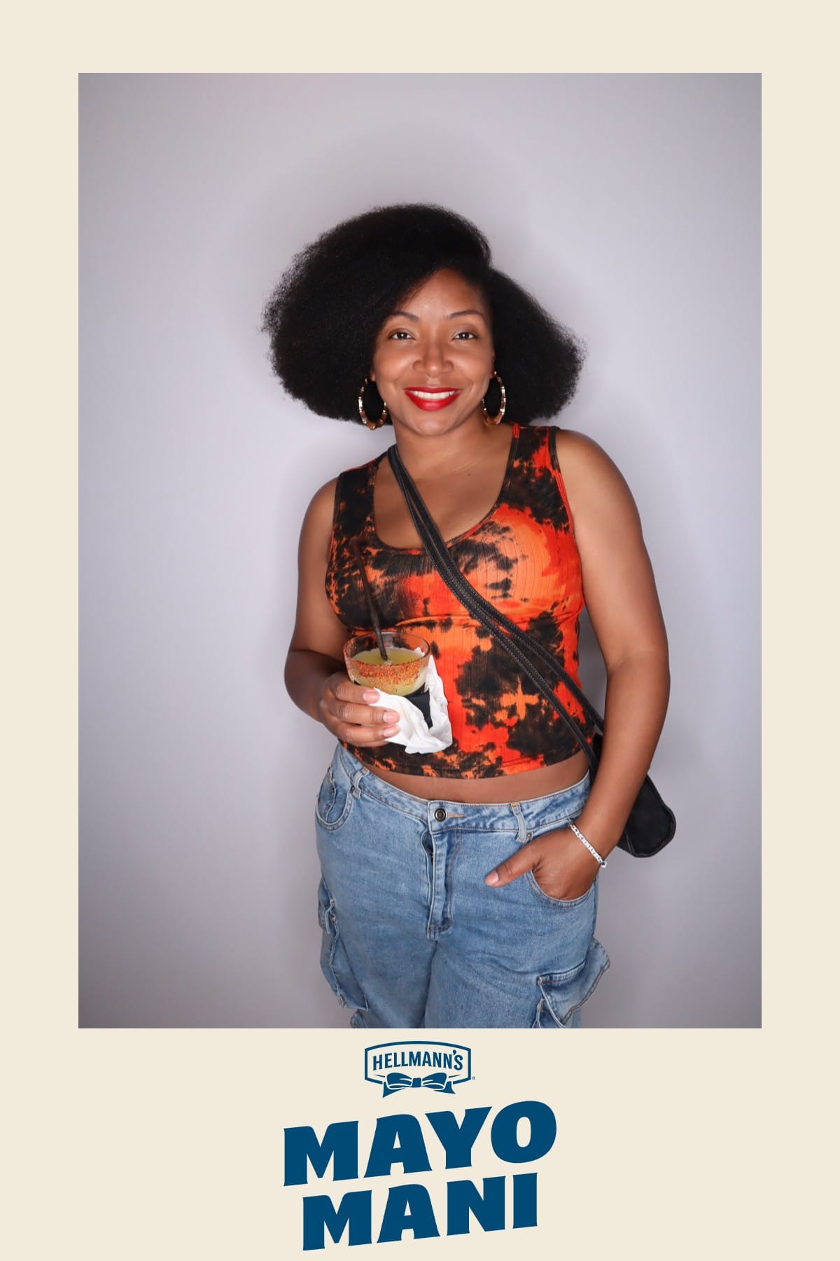 Guest holding a Hellmann's Chipotle Mayonnaise Dressing bottle up to her cheek