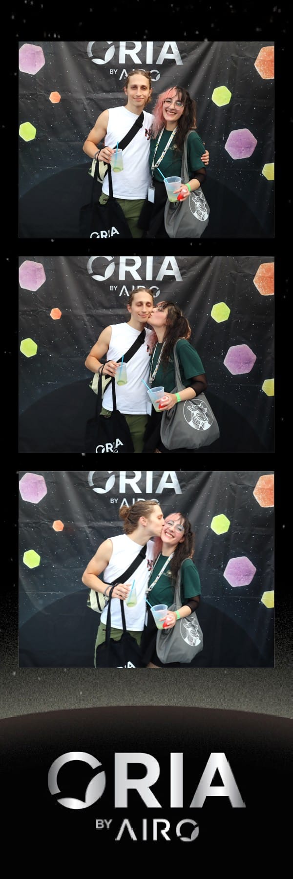 Couple sharing a kiss at the Oria by Airo photo strip booth