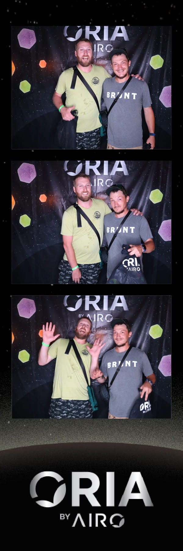 Two friends in coordinated outfits posing at the Oria by Airo booth