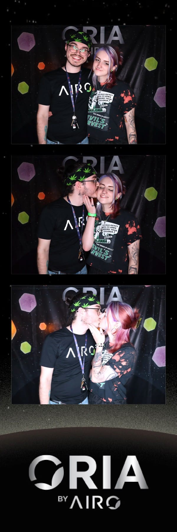 Two friends posing at the Oria by Airo cosmic backdrop, one in a bandana