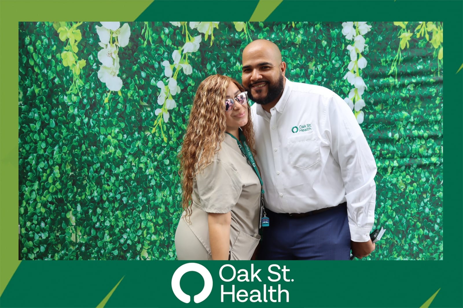 Four Oak St. Health team members posing together at the celebration