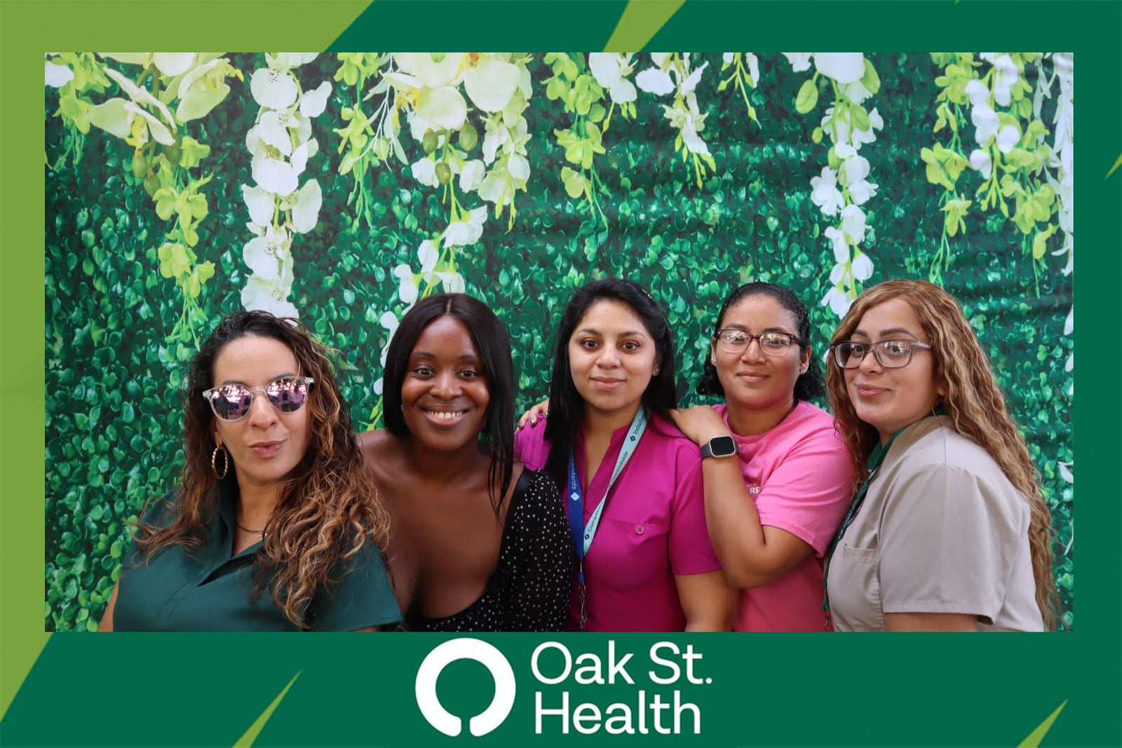 Couple posing together at the Oak St. Health team celebration booth