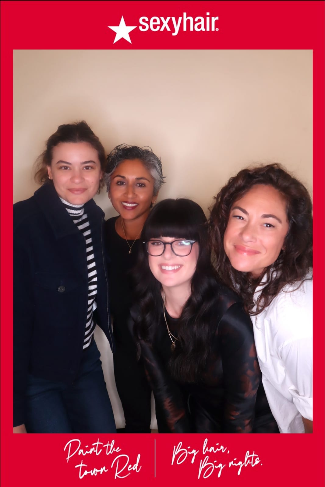 Four SexyHair team members posing together — Paint the Town Red print frame