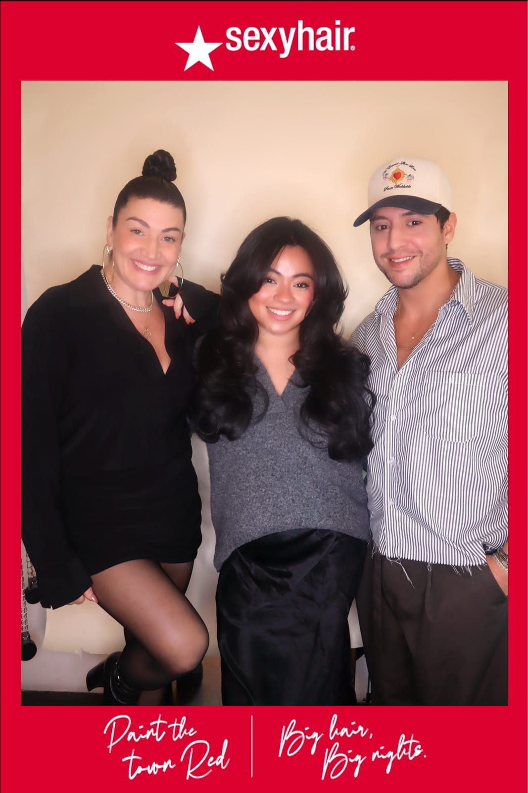 Three SexyHair team members posing together, one in a striped cap