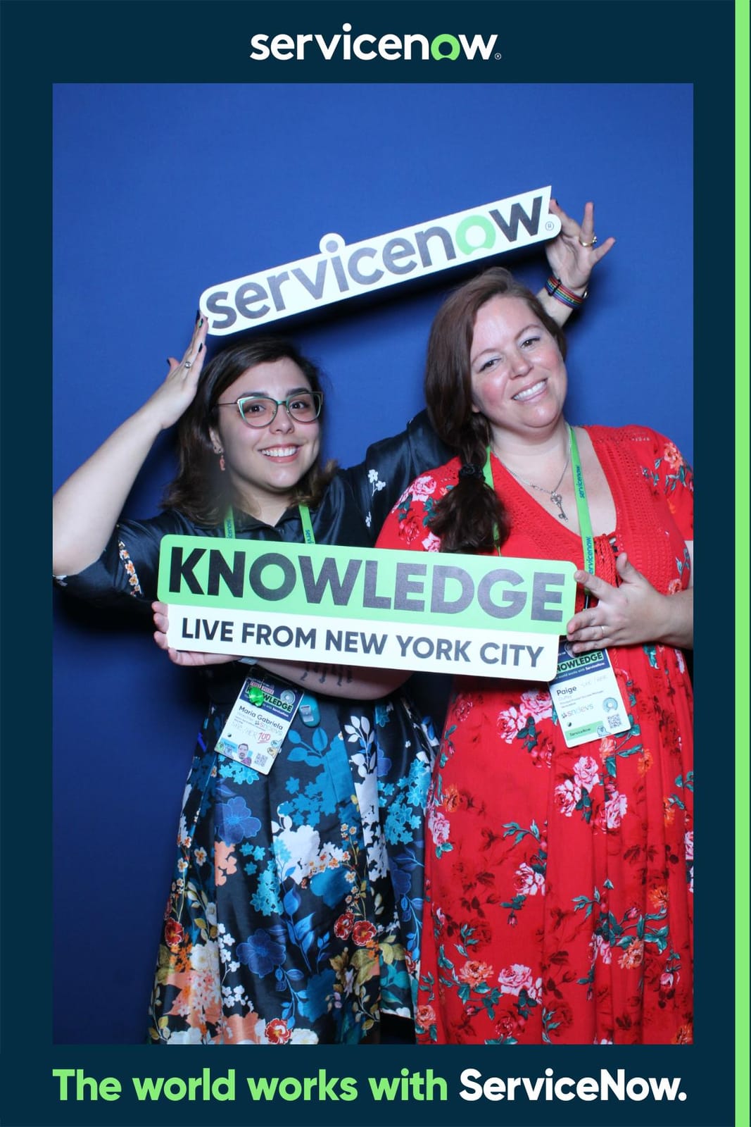 Two attendees at the ServiceNow conference photo booth