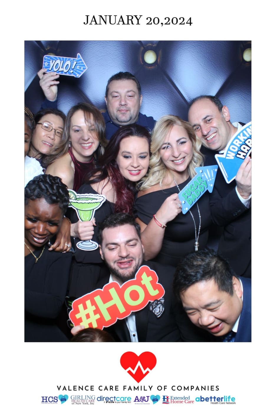 Two guests posing at the Valence Care winter gala photo booth