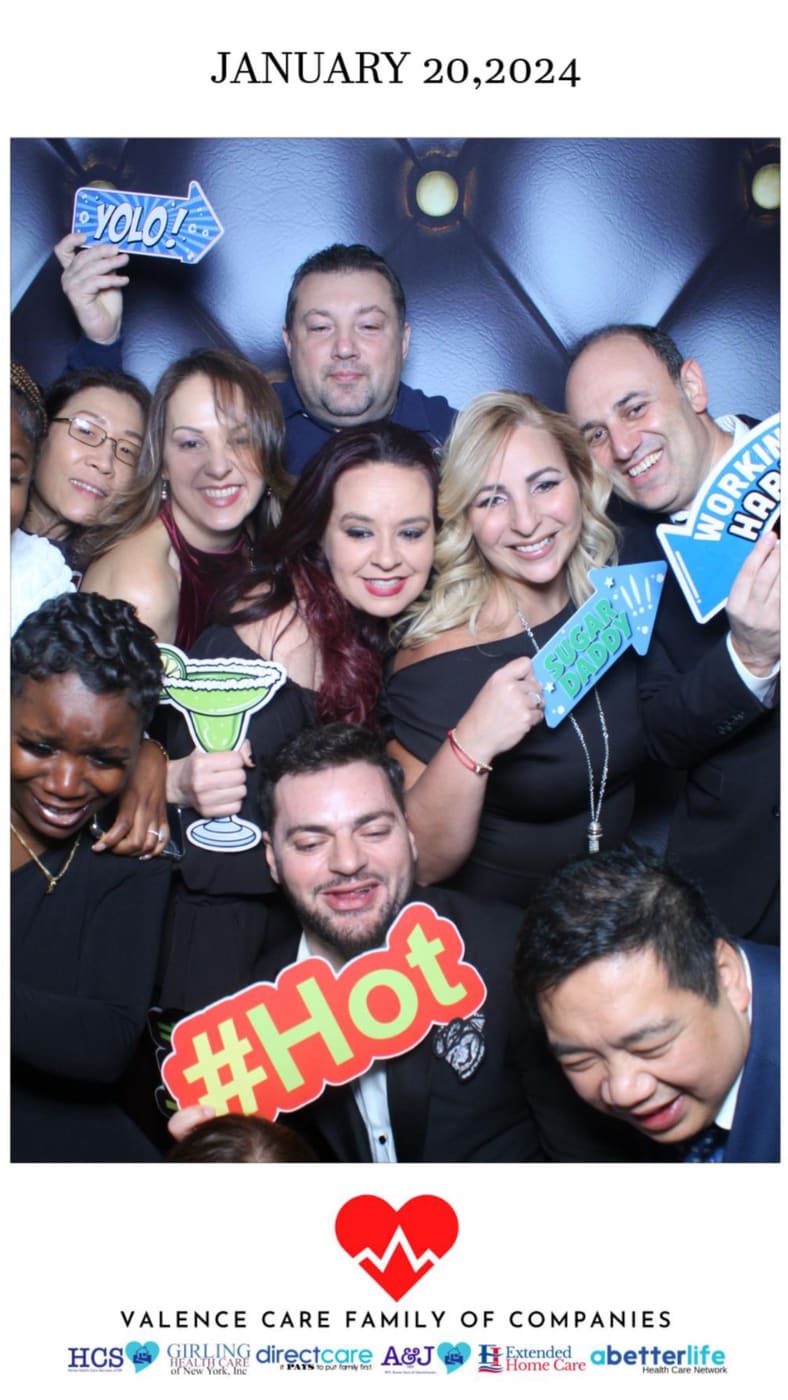 Colleagues celebrating at the Valence Care gala photo booth