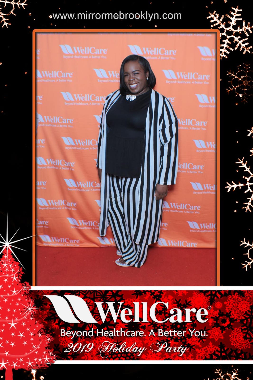 Colleagues posing with props at the WellCare Holiday Party
