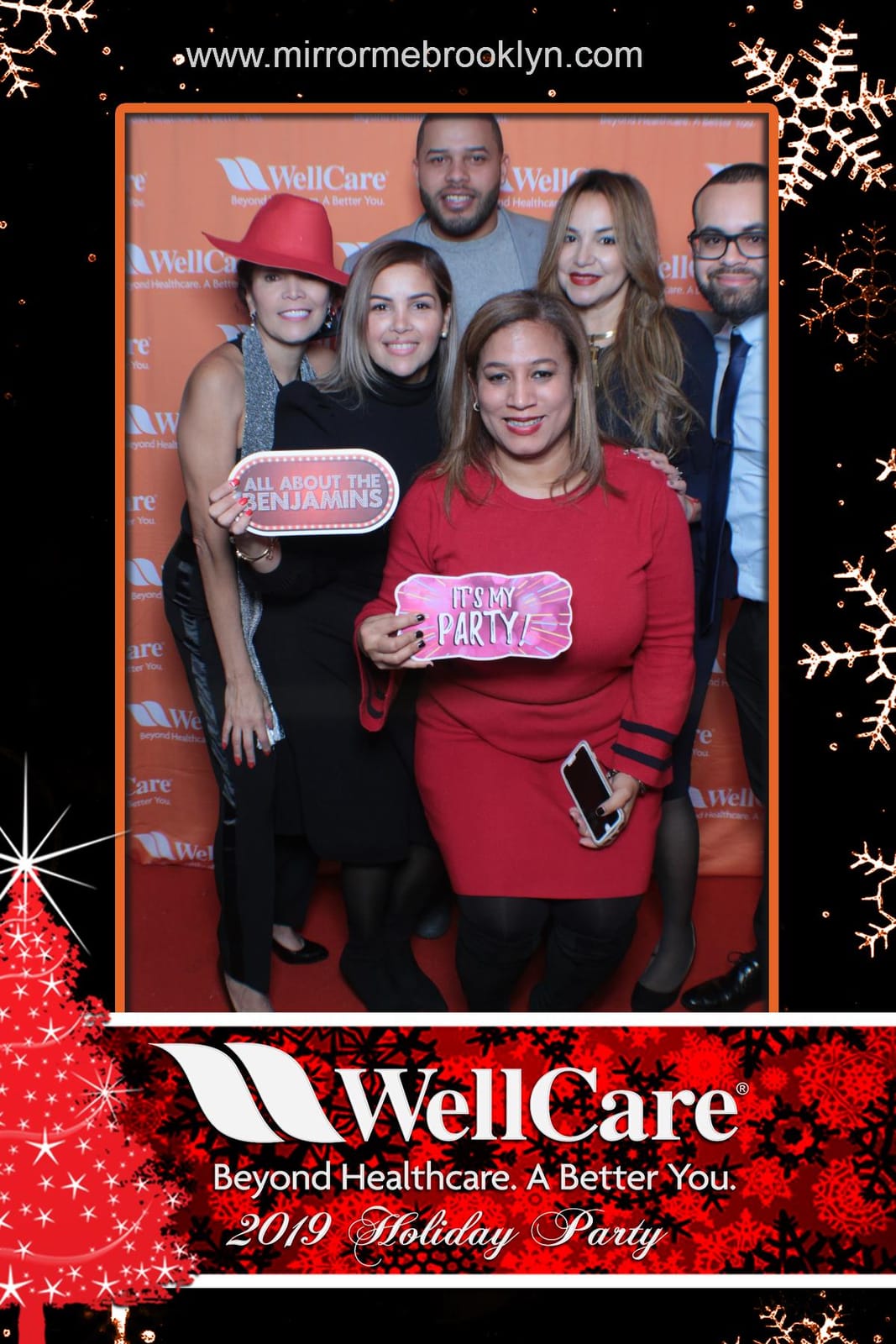 Guests at the WellCare 2019 Holiday Party photo booth